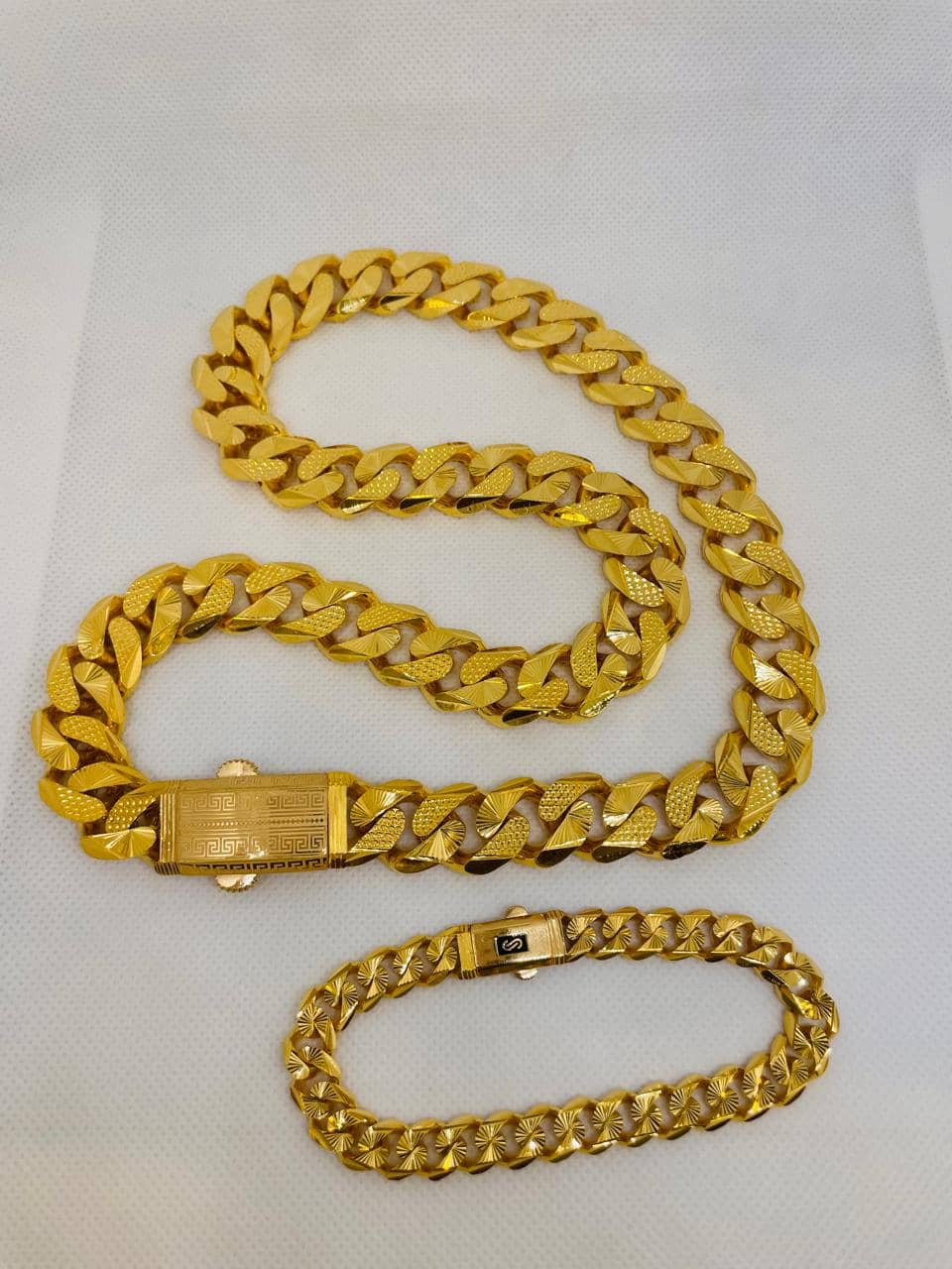Gold Cuban link chain with matching bracelet